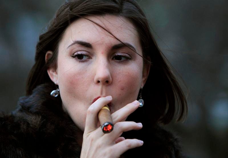 More women are smoking cigars, picture