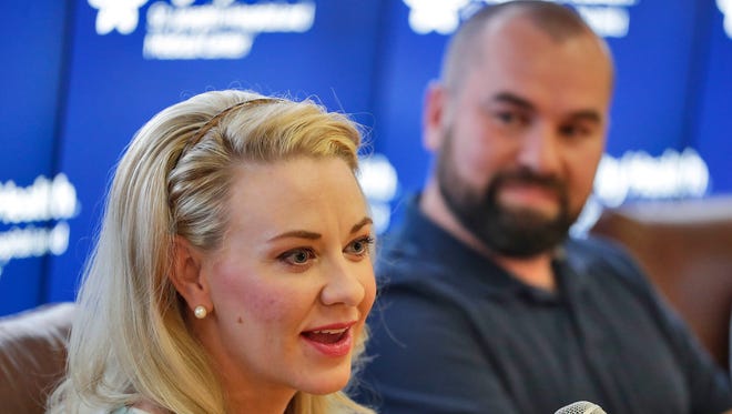 Jamie Scott, accompanied by her husband, Skyler, speaks during a news conference at St. Joseph's Hospital and Medical Center in Phoenix on April 6, 2018. Jamie gave birth to quintuplets on March 21, 2018. The three girls and two boys, weighing less than 3 pounds each, will be able to leave the hospital in May, according to the hospital.