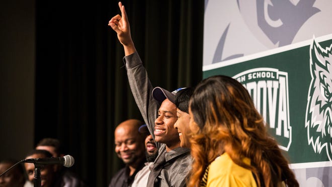 April 13, 2018 - Cordova point guard Tyler Harris, center, celebrates after announcing that he was signing a national letter of intent with the Tigers.
