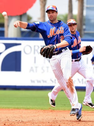 New York Mets second baseman Neil Walker throws to first base for an out during the Thursday, March 24, 2016 spring training game against Houston Astros at Tradition Field in Port St. Lucie.