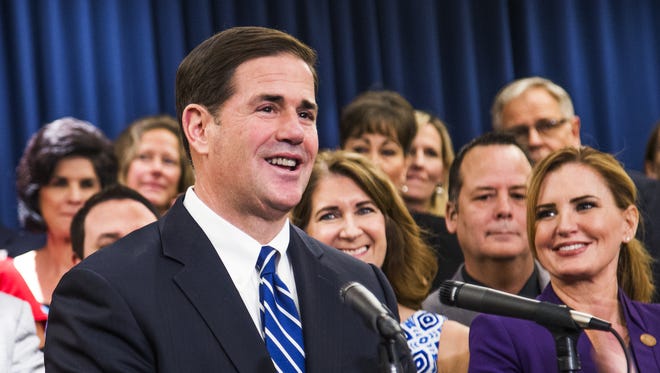 Gov. Doug Ducey announces a new plan to increase compensation for teachers during a press conference at the Capitol in Phoenix on April 12, 2018.