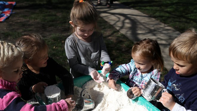 Students from the ECE Center and Lab School play engage in a sensory activity during the Week of the Young Child Sensory Exploration at Shasta College.