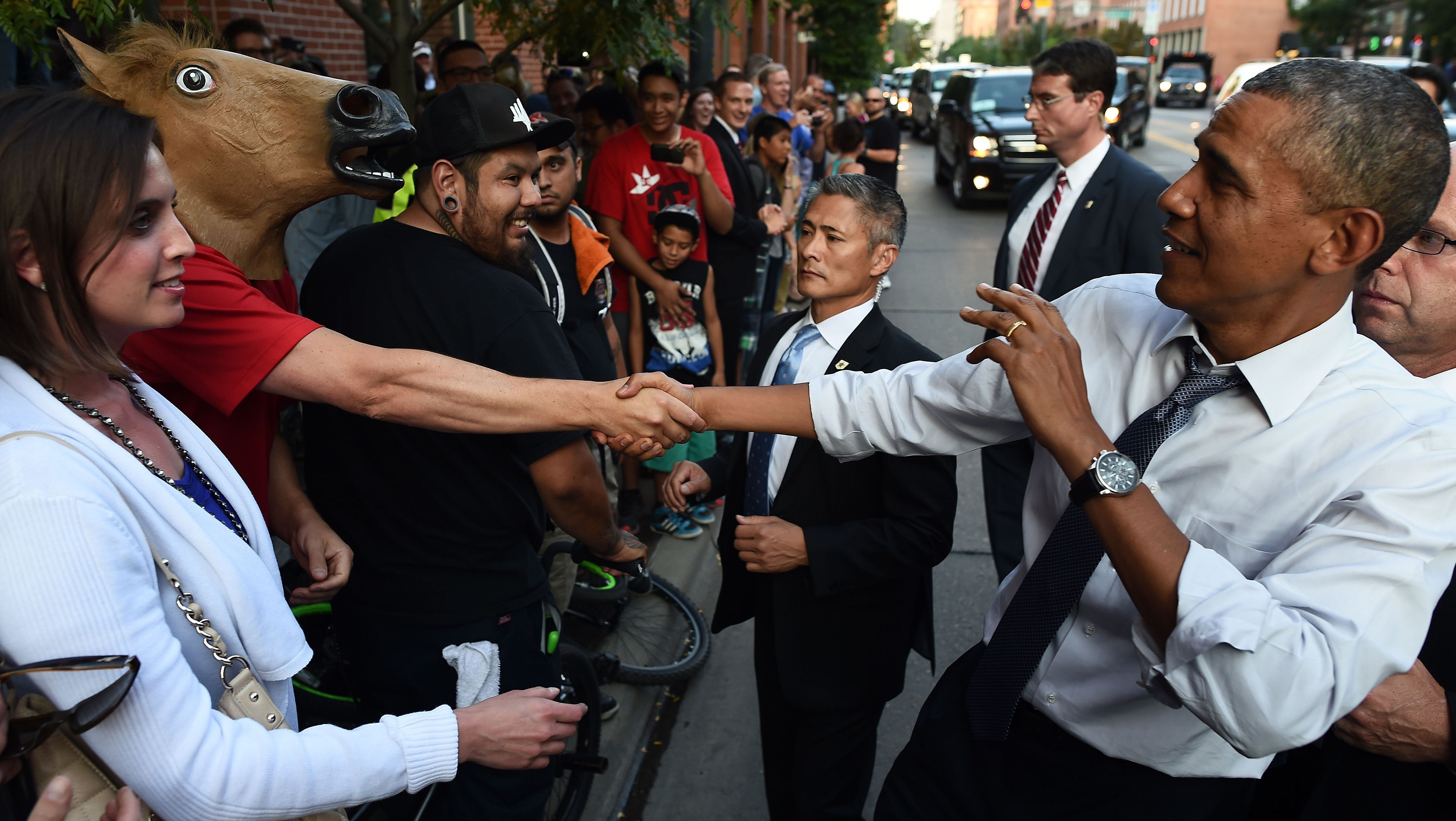 Obama Shakes Hands With Supporter Wearing Horse Head