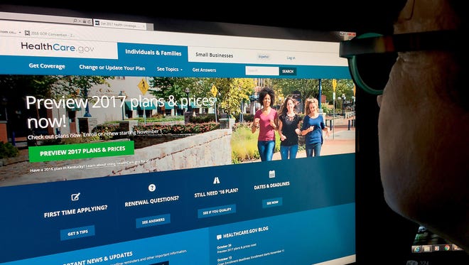 A woman looks at the Healthcare.gov website in Washington, D.C.
