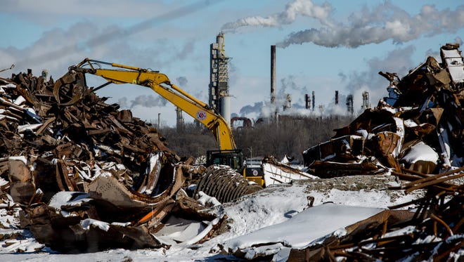 Removal of debris and scrap metal is ongoing Thursday, Feb. 11, 2016, at the site of the former DTE power plant  in Marysville.