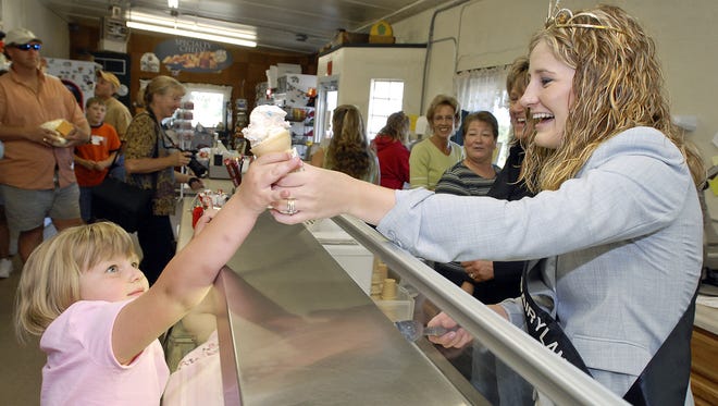 2006 Alice in Dairyland Nicole Reese visits Pine River Dairy as she serves up a bubble gum ice cream cone to Rachel Robley, 5 of Manitowoc Sept. 1, 2006.  Marilyn Robley brought her grandchildren to the store "to see Alice in Dairyland because the girls just love to see a princess."