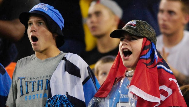 Tennessee Titans fans celebrate after a play during the first half against San Diego Chargers at Nissan Stadium.