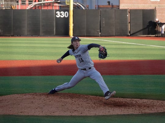 Xavier University freshman Lane Flamm pitches against