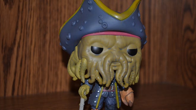 Funko Pops! vinyl figure collectibles depict a variety of real and fictional characters, like this one, of Davy Jones from the movie, “Pirates of the Caribbean.”