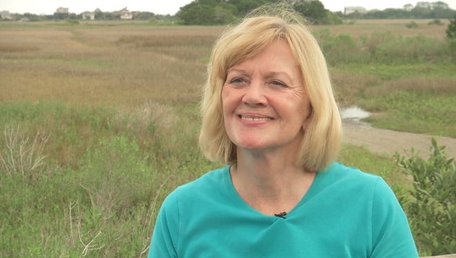 Historical Archaeologist Kathleen Deagan stands on a boardwalk that provides a view of the marsh island where she discovered the site of Fort Mose from Florida’s Spanish Colonial period. Located just north of St. Augustine, Fort Mose was the first legally sanctioned free black community in what would become the United States.