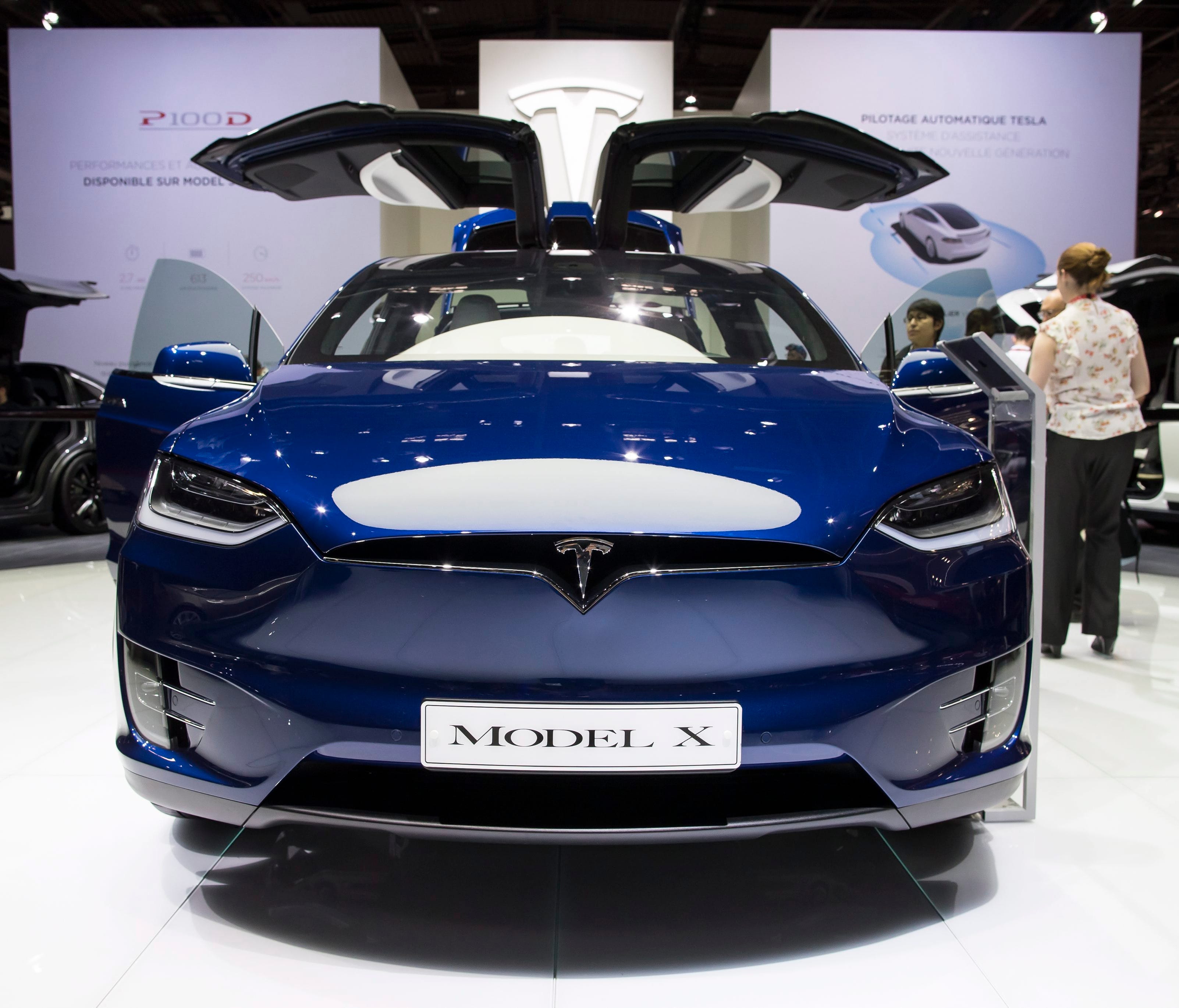 A Tesla Model X is displayed at the Paris Motor Show in Paris on Sept. 30, 2016. The base model has a 237 mile range and starts at $79,500, according to Tesla.