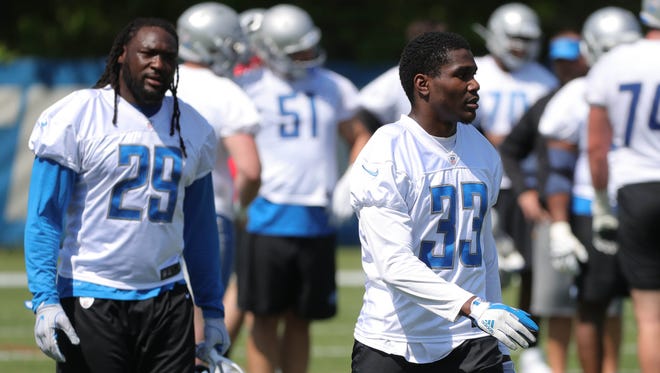 Lions running backs LeGarrette Blount and Kerryon Johnson move to the next drill during OTAs on May 24, 2018, at the Allen Park practice facility.