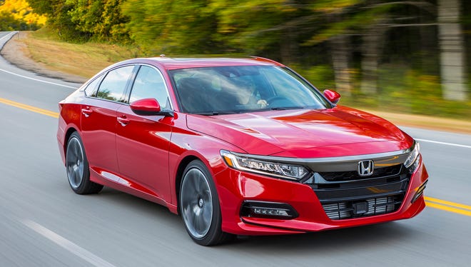 This photo provided by Honda shows the 2018 Honda Accord, a midsize sedan that's available with a manual transmission. The Accord makes an excellent family car, and the manual transmission provides an added level of driver engagement.