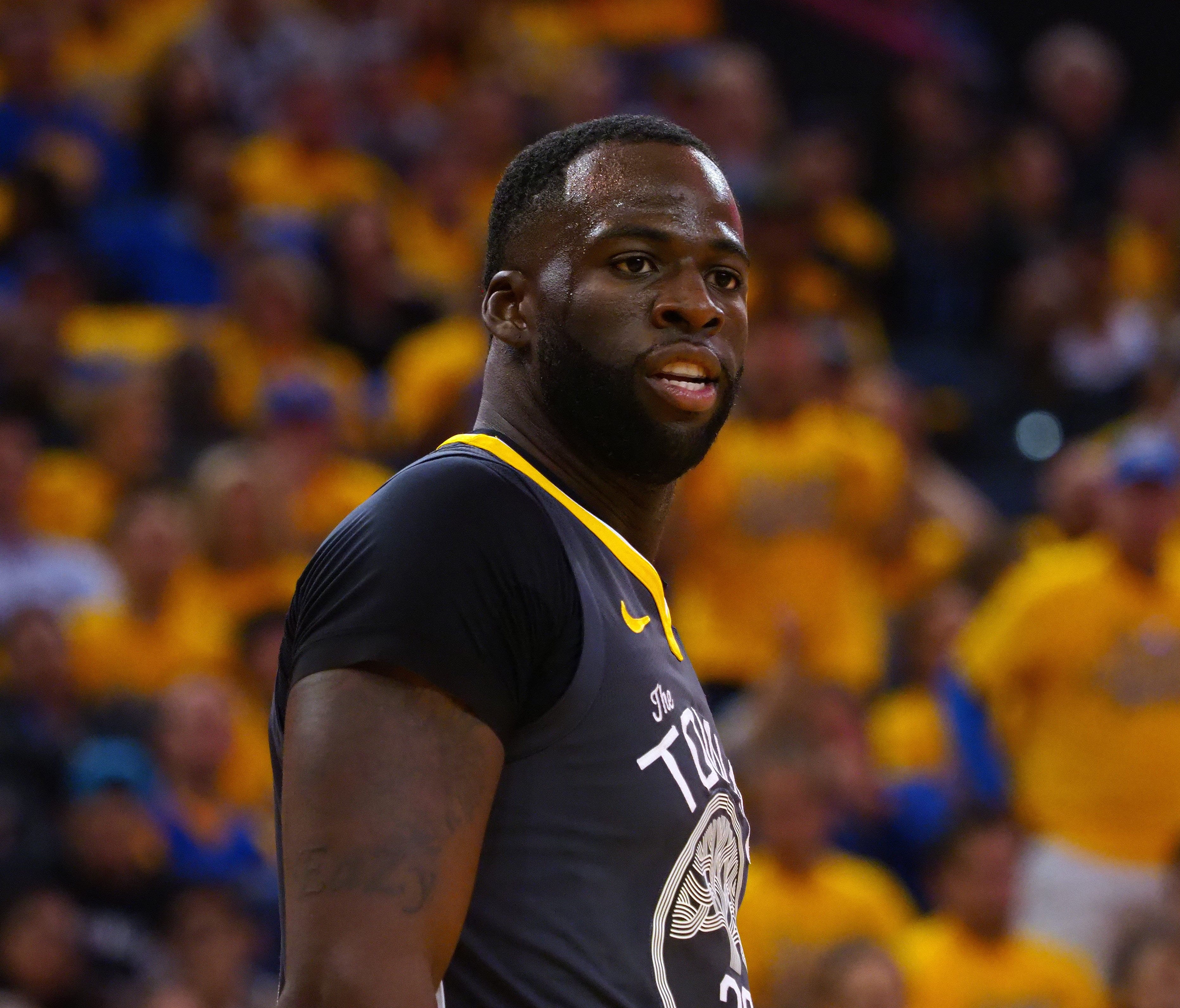 Golden State Warriors forward Draymond Green reacts to a call against the San Antonio Spurs.