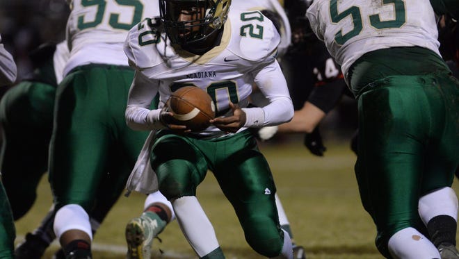 Acadiana QB Myles Hutchinson looks to hand off the ball while playing against Parkway in the Class 5A playoff game.
Acadiana quarterback Myles Hutchinson looks to hand off the ball while playing against Parkway in the Class 5A second round playoff game.