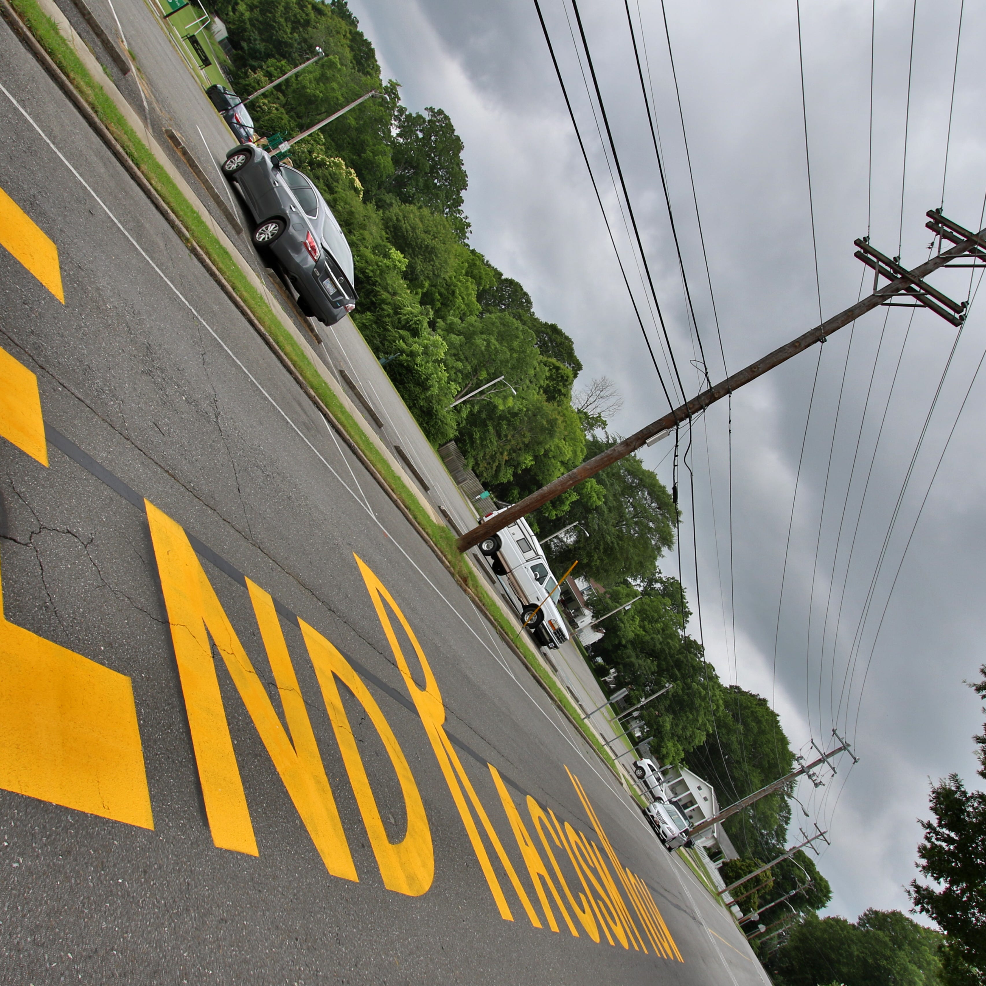 The phrase &ldquo;End Racism Now&rdquo; painted on West Church Street in Dallas Monday morning, June 22, 2020.