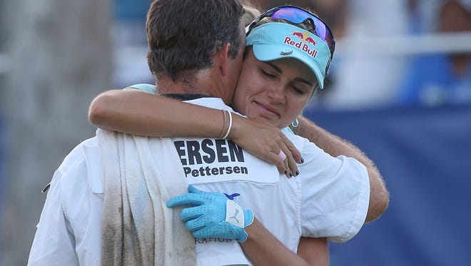 Lesi Thompson gets a hug from Suzann Petersen's caddie David Jones after the ANA Inspiration in Rancho Mirage, April 2, 2017. 