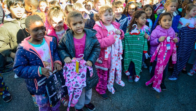 Students at Yonkers Montessori Academy participate in the Stuff a Bus in Westchester program, Nov. 7, 2016.