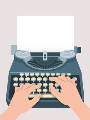 Retro manual typewriter with printing hands and sheet of paper