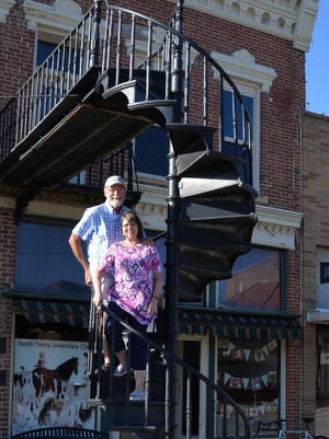 Curt and Ginnie Swarm on the circular iron steps in Traer, built by the Burlington Iron Works in 1894.