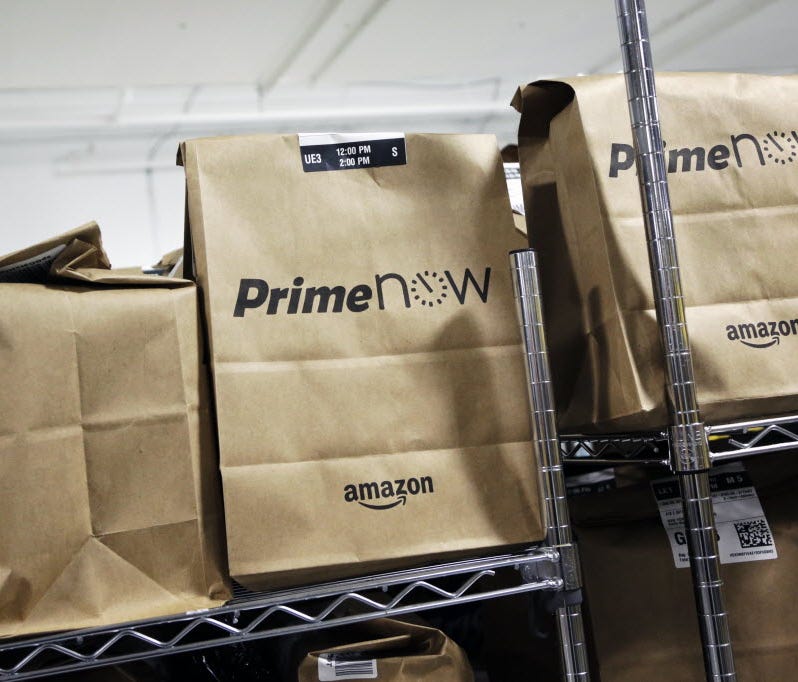 Bags are loaded for delivery at Amazon's urban fulfillment facility, Tuesday, Dec. 22, 2015 in New York. Amazon Prime Now is one of the perks of Amazon Prime membership.