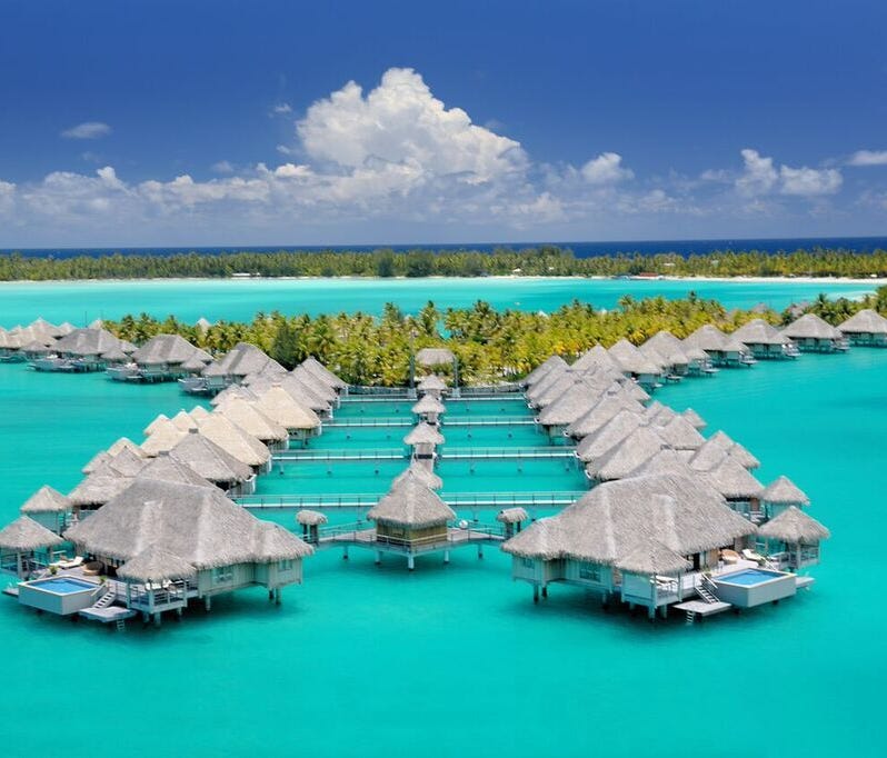 St. Regis Bora Bora is a honeymoon favorite and is well-known in the U.S. for its 44-acre resort with multiple restaurants, a spa and white-sand beaches. Rates start at $1,438 per night, but the best part is that travelers can redeem Marriott Rewards