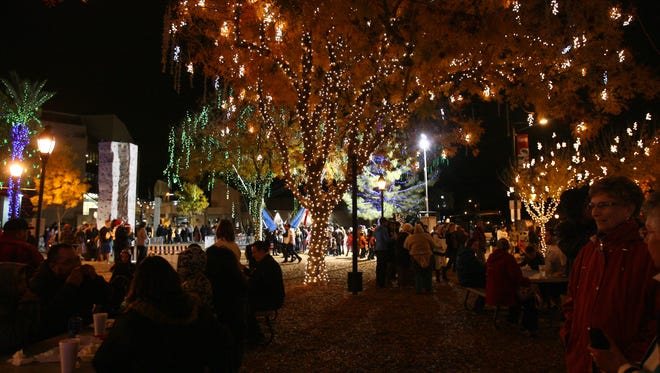 Event goers enjoy music and food at Glendale Glitters, in downtown Glendale. Glendale has awarded a three-year agreement with Courier Graphics Corp to publish a quarterly magazine that highlights recreational and cultural events, classes and programs offered by the city.