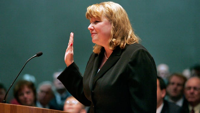 In this March 13, 2006 file photo, Allison Eid is sworn in as a justice of the Colorado Supreme Court in Denver. Presumptive Republican presidential nominee Donald Trump has released a list of 11 potential Supreme Court justices he plans to vet to fill the seat of late Justice Antonin Scalia.