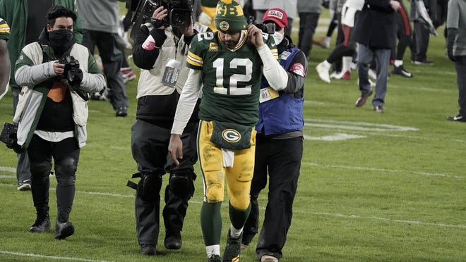 Green Bay Packers quarterback Aaron Rodgers (12) walks off the field after the NFC championship NFL football game against the Tampa Bay Buccaneers in Green Bay, Wis., Sunday, Jan. 24, 2021. The Buccaneers defeated the Packers 31-26 to advance to the Super Bowl.