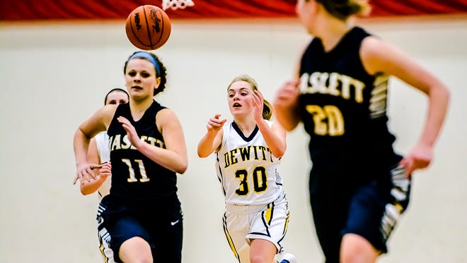 Mackenzie Dawes ,30, of DeWitt passes to a teammate on a fastbreak during the Panthers' game with Haslett.