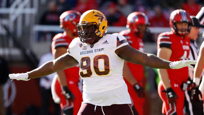 Arizona State Sun Devils defensive lineman Tashon Smallwood (90) reacts after making a stop in the third quarter against the Utah Utes at Rice-Eccles Stadium.