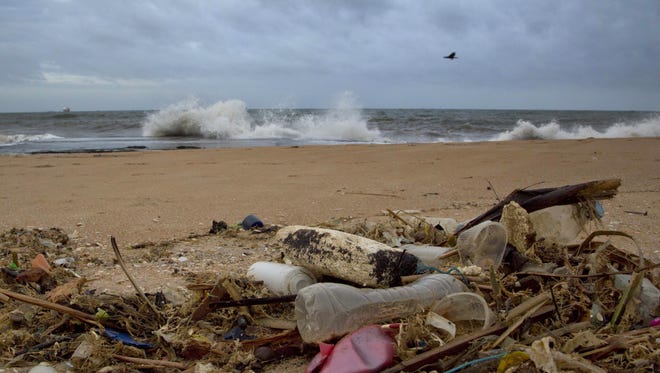 Debris washed ashore on the Indian Ocean beach of Uswetakeiyawa, Sri Lanka.