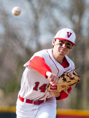 Vineland starting pitcher Joe Acosta (14) throws to an Oakcrest batter at Vineland High School on Wednesday, April 12.