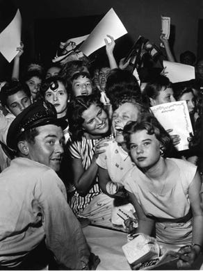 Elvis Presley fans hoping for the chance to get his autograph on the night of May 15, 1956, at Ellis Auditorium, where Elvis performed for more than 7,000. His performance was a feature of Cotton Carnival opening night.