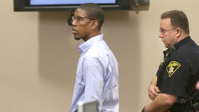 Thomas Johnson lll enters the courtroom for  opening statements in his murder trial on April 27, 2015.