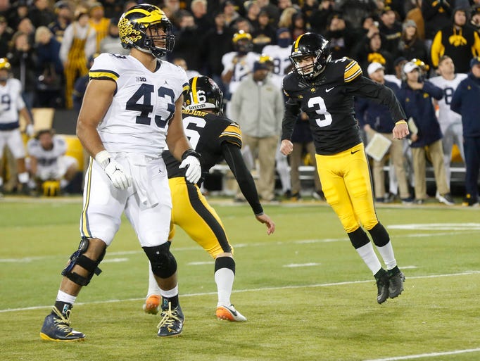 Iowa kicker Keith Duncan starts to celebrate after