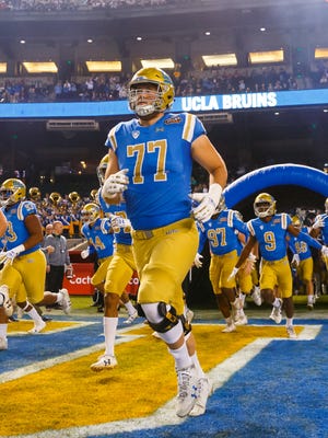 UCLA offensive lineman Kolton Miller takes the field last season. Miller could be a target for the Philadelphia Eagles if he slips to them at No. 32.
