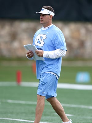 North Carolina defensive coordinator Gene Chizik is shown during an NCAA college football practice in Chapel Hill, N.C.