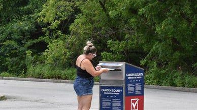 A woman casts her ballot Tuesday at a Camden County elections drop box in Cherry Hill.