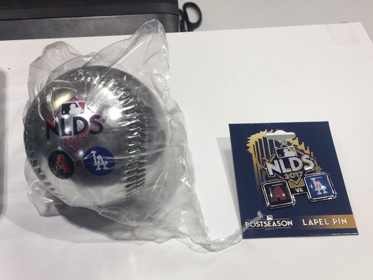 National League Division Series lapel pins and balls