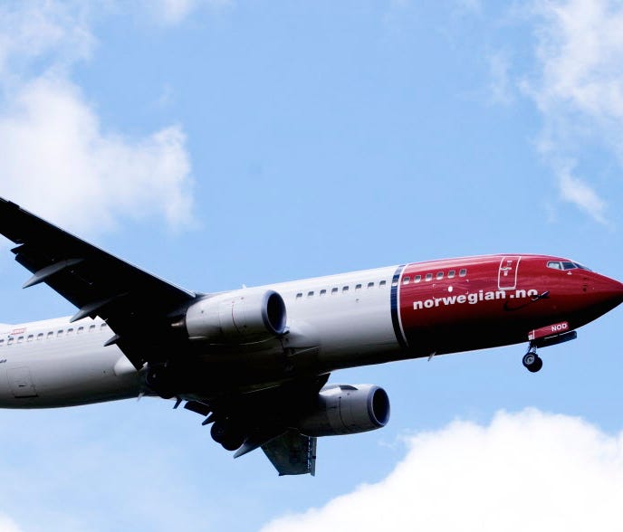 A Boeing 737-800 of low-cost Norwegian Air Shuttle flies near Oslo airport in Gardermoen on July 17, 2009.