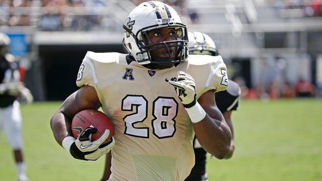 University of Central Florida running back William Stanback runs for a 70-yard touchdown during the Knights' spring game..