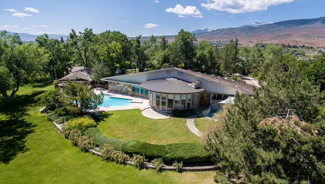 A bird’s eye view of the Gunnerman estate that occupies five secluded acres atop Windy Hill. The estate comprises a main residence, guest cottage and entertaining cottage. It’s for sale for $3.195 million.