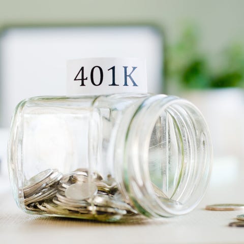 Coin jar labeled 401(k) that's tipped over.