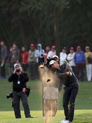 Justin Rose of England hits from the fairway during the final round of the 2017 WGC-HSBC Champions golf tournament held at the Sheshan International Golf Club in Shanghai, China, Sunday, Oct. 29, 2017. Justin Rose took advantage of a record-tying collapse by Dustin Johnson and rallied from eight shots behind to win the HSBC Champions.(AP Photo/Ng Han Guan)