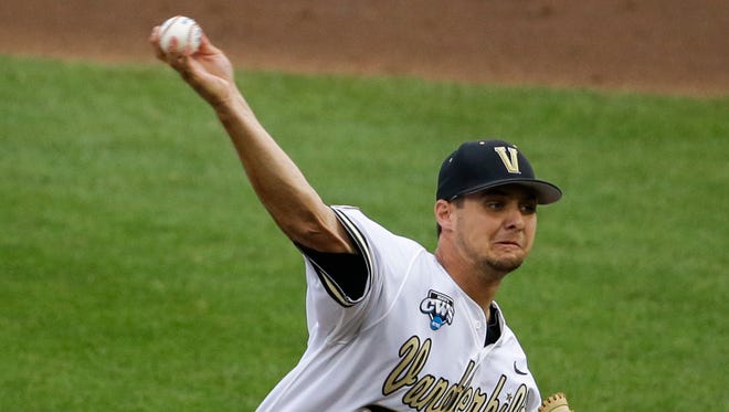 Vanderbilt pitcher Tyler Beede (11) delivers against UC Irvine in the first inning of an NCAA baseball College World Series game in Omaha, Neb., Monday, June 16, 2014. (AP Photo/Nati Harnik)