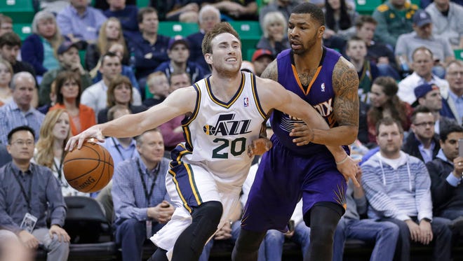 Gordon Hayward, left, will stay with the Utah Jazz after the team matched an offer sheet from the Charlotte Hornets for a four-year, $63 million contract.