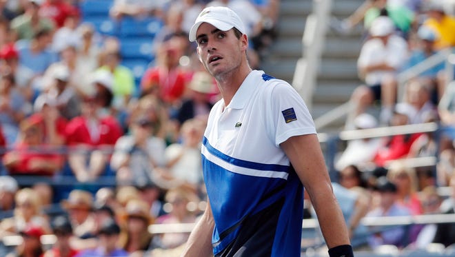 John Isner (USA) reacts to losing a point to Philipp Kohlschreiber (GER) on Armstrong Stadium.