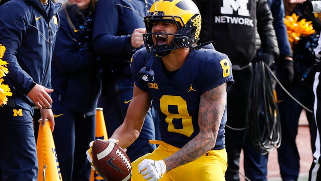 Michigan wide receiver Ronnie Bell (8) reacts after a reception against Michigan State in the first half of an NCAA college football game in Ann Arbor, Mich., Saturday, Nov. 16, 2019. (AP Photo/Paul Sancya)
