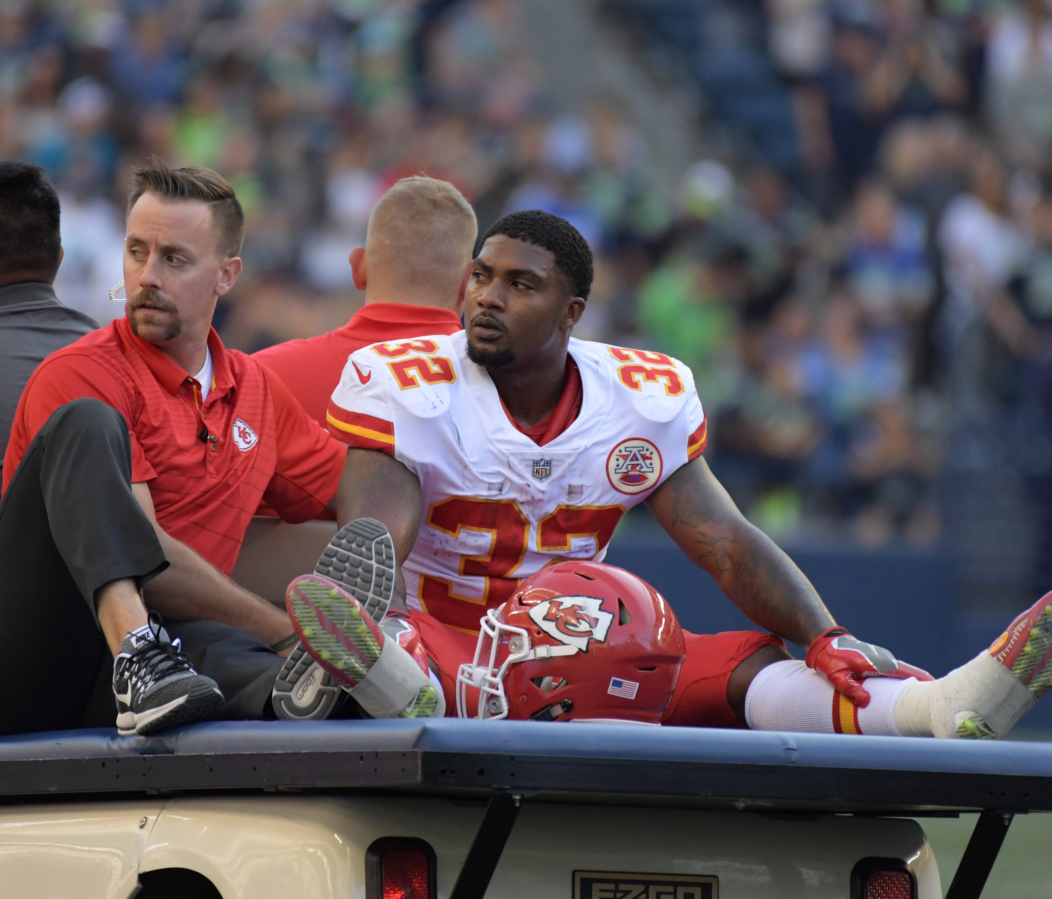 Kansas City Chiefs running back Spencer Ware (32) is taken off the field with an injury during a NFL football game against the Seattle Seahawks at CenturyLink Field.